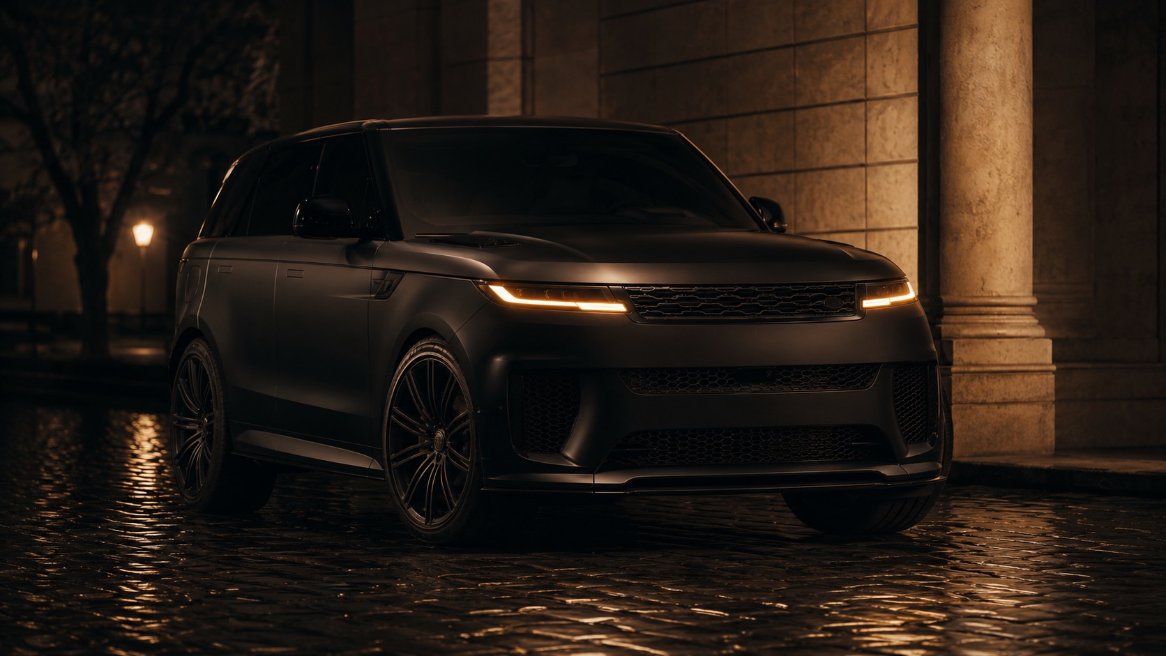 A matte-black Range Rover Sport SV from a low front three-quarter angle, slim LED daytime running lights catching the night air.