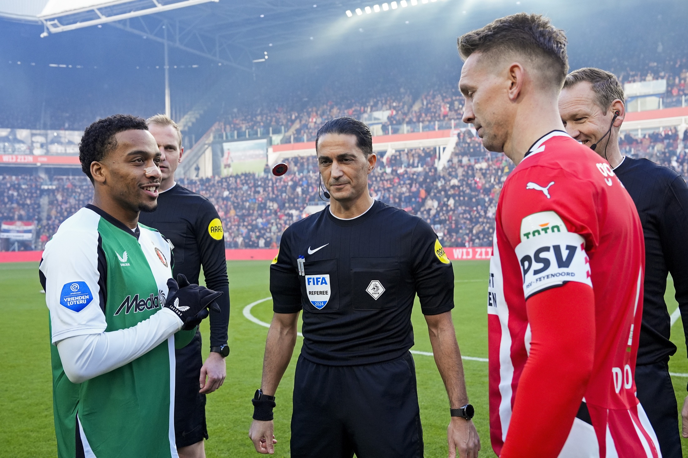Serdar Gözübüyük at the coin toss with two captains